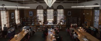 Movie still from “Halloween” (2007), directed by Rob Zombie – A group of people sitting at a table in a library; Extreme Wide shot, High angle