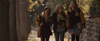 Movie still from “Halloween” (2007), directed by Rob Zombie – Two women walking down a path in the woods; Medium shot, Low angle