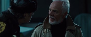 Movie still from “Halloween” (2007), directed by Rob Zombie – An older man wearing a jacket and a fur hat; Close Up shot, Over the shoulder angle