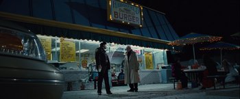 Movie still from “Halloween” (2007), directed by Rob Zombie – Two men standing in front of a burger joint; Wide shot, Over the shoulder angle