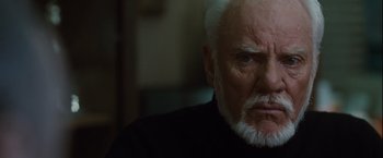 Movie still from “Halloween” (2007), directed by Rob Zombie – An older man with a white beard looking at the camera; Close Up shot, Low angle
