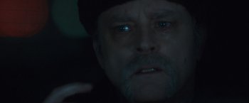 Movie still from “Halloween” (2007), directed by Rob Zombie – A person with a hat on; Close Up shot, Over the shoulder angle