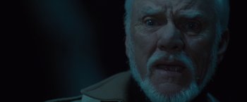 Movie still from “Halloween” (2007), directed by Rob Zombie – An old man with a beard looking at the camera; Close Up shot, Low angle