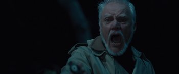 Movie still from “Halloween” (2007), directed by Rob Zombie – An old man with a gray beard is screaming; Close Up shot, Low angle