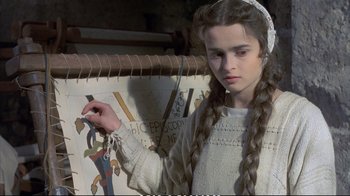 Movie still from “Hamlet” (1990), directed by Franco Zeffirelli – A young girl is painting a picture on a wall; Close Up shot, High angle
