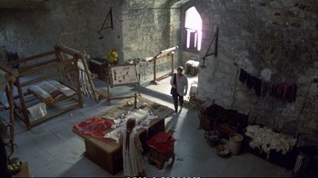 Movie still from “Hamlet” (1990), directed by Franco Zeffirelli – A man standing in the middle of a room; Extreme Wide shot, High angle
