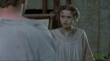 Movie still from “Hamlet” (1990), directed by Franco Zeffirelli – A young girl looking into a mirror in front of a man; Close Up shot, Over the shoulder angle