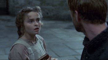 Movie still from “Hamlet” (1990), directed by Franco Zeffirelli – A young girl is talking to an older man; Close Up shot, Over the shoulder angle