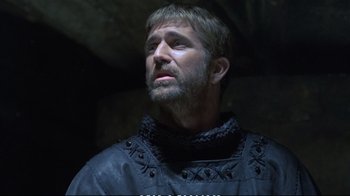 Movie still from “Hamlet” (1990), directed by Franco Zeffirelli – A person wearing a leather jacket; Close Up shot, Low angle