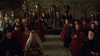Movie still from “Hamlet” (1990), directed by Franco Zeffirelli – A group of people dressed in medieval clothing; Wide shot, High angle