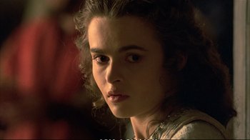 Movie still from “Hamlet” (1990), directed by Franco Zeffirelli – A person wearing a white shirt; Close Up shot, Over the shoulder angle