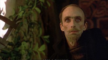 Movie still from “Hamlet” (1990), directed by Franco Zeffirelli – A person with a beard; Close Up shot, Over the shoulder angle