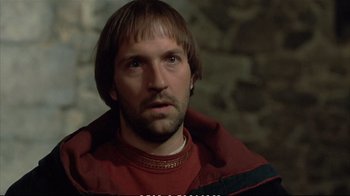 Movie still from “Hamlet” (1990), directed by Franco Zeffirelli – A person wearing a red shirt; Close Up shot, Low angle