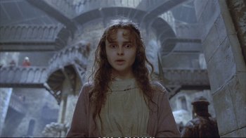 Movie still from “Hamlet” (1990), directed by Franco Zeffirelli – A young girl with long curly hair and a white dress; Medium shot, Low angle