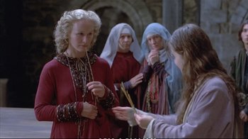 Movie still from “Hamlet” (1990), directed by Franco Zeffirelli – A group of women in medieval garb standing next to each other; Medium shot, High angle