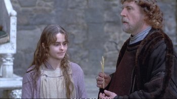 Movie still from “Hamlet” (1990), directed by Franco Zeffirelli – A man and a woman standing next to each other; Medium shot, Over the shoulder angle
