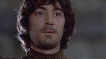 Movie still from “Hamlet” (1990), directed by Franco Zeffirelli – A person wearing a brown shirt; Close Up shot, Low angle