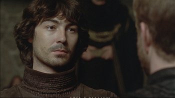 Movie still from “Hamlet” (1990), directed by Franco Zeffirelli – A person wearing a sweater; Close Up shot, Over the shoulder angle
