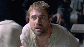 Movie still from “Hamlet” (1990), directed by Franco Zeffirelli – A person with a beard; Close Up shot, Low angle
