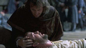 Movie still from “Hamlet” (1990), directed by Franco Zeffirelli – A man in medieval garb touching another man's face; Close Up shot, Over the shoulder angle