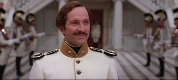 Movie still from “Hamlet” (1996), directed by Kenneth Branagh – A man in a white and gold uniform; Close Up shot, Low angle