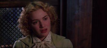 Movie still from “Hamlet” (1996), directed by Kenneth Branagh – A person with curly blonde hair; Close Up shot, Low angle