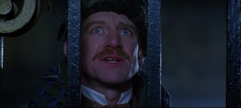 Movie still from “Hamlet” (1996), directed by Kenneth Branagh – A person with a beard and mustache; Close Up shot, Low angle