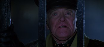 Movie still from “Hamlet” (1996), directed by Kenneth Branagh – An older man in a uniform looking up at the sky; Close Up shot, Low angle