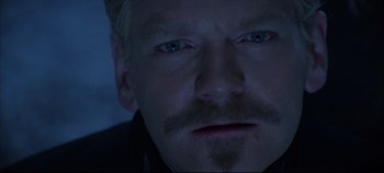 Movie still from “Hamlet” (1996), directed by Kenneth Branagh – A man with a mustache; Close Up shot, Over the shoulder angle