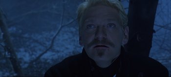 Movie still from “Hamlet” (1996), directed by Kenneth Branagh – A person wearing a jacket; Close Up shot, Over the shoulder angle