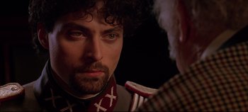 Movie still from “Hamlet” (1996), directed by Kenneth Branagh – A person with a beard; Close Up shot, Over the shoulder angle