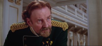 Movie still from “Hamlet” (1996), directed by Kenneth Branagh – A person with a beard wearing a uniform; Close Up shot, Low angle