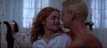 Movie still from “Hamlet” (1996), directed by Kenneth Branagh – A man and a woman in a room with a window in the background; Close Up shot, Low angle