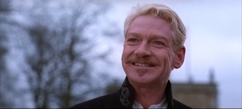 Movie still from “Hamlet” (1996), directed by Kenneth Branagh – A person wearing a black jacket; Close Up shot, Over the shoulder angle