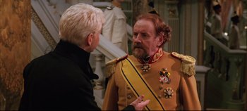 Movie still from “Hamlet” (1996), directed by Kenneth Branagh – A man in a military uniform talking to another man; Close Up shot, Over the shoulder angle