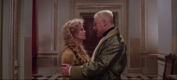 Movie still from “Hamlet” (1996), directed by Kenneth Branagh – A man and a woman standing next to each other; Medium shot, Low angle