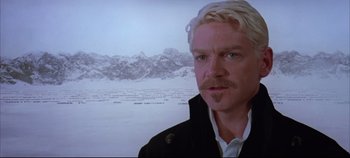 Movie still from “Hamlet” (1996), directed by Kenneth Branagh – A man that is standing in front of a screen; Close Up shot, Over the shoulder angle