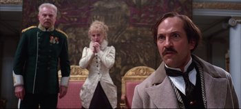 Movie still from “Hamlet” (1996), directed by Kenneth Branagh – A man and a woman standing next to each other in a room; Close Up shot, Over the shoulder angle