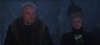 Movie still from “Hamlet” (1996), directed by Kenneth Branagh – A man and a woman dressed up in a dark forest; Close Up shot, Over the shoulder angle