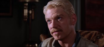 Movie still from “Hamlet” (1996), directed by Kenneth Branagh – A person with a mustache; Close Up shot, Over the shoulder angle