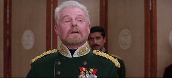 Movie still from “Hamlet” (1996), directed by Kenneth Branagh – A man in a military uniform with a beard; Close Up shot, Low angle