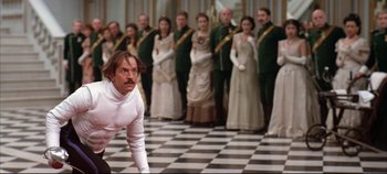 Movie still from “Hamlet” (1996), directed by Kenneth Branagh – A group of people dressed in costumes and standing in a room; Medium shot, Low angle
