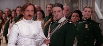 Movie still from “Hamlet” (1996), directed by Kenneth Branagh – A group of men in military garb posing for a picture; Medium shot, Low angle