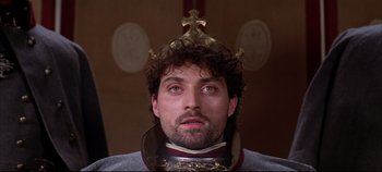 Movie still from “Hamlet” (1996), directed by Kenneth Branagh – A person wearing a crown; Close Up shot, Low angle