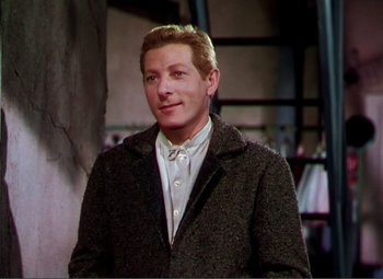 Movie still from “Hans Christian Andersen” (1952), directed by Charles Vidor – A man wearing a jacket and a white shirt; Medium shot, High angle