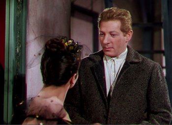 Movie still from “Hans Christian Andersen” (1952), directed by Charles Vidor – A man and a woman standing next to each other; Medium shot, Over the shoulder angle