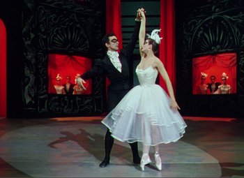 Movie still from “Hans Christian Andersen” (1952), directed by Charles Vidor – A man and a woman dancing on a stage; Wide shot, Low angle