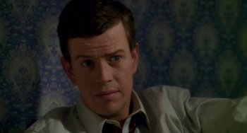 Movie still from “Happiness” (1998), directed by Todd Solondz – A person wearing a shirt and tie; Close Up shot, High angle