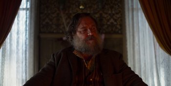Movie still from “True History of the Kelly Gang” (2019), directed by Justin Kurzel – An older man with a beard and a mustache; Close Up shot, Low angle