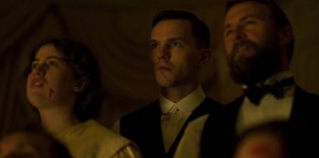 Movie still from “True History of the Kelly Gang” (2019), directed by Justin Kurzel – A man in a vest and tie looking up; Close Up shot, Low angle